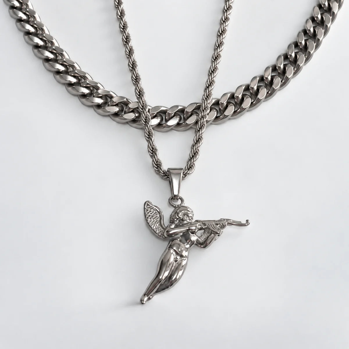 cupid pendant necklace silver layered set white background