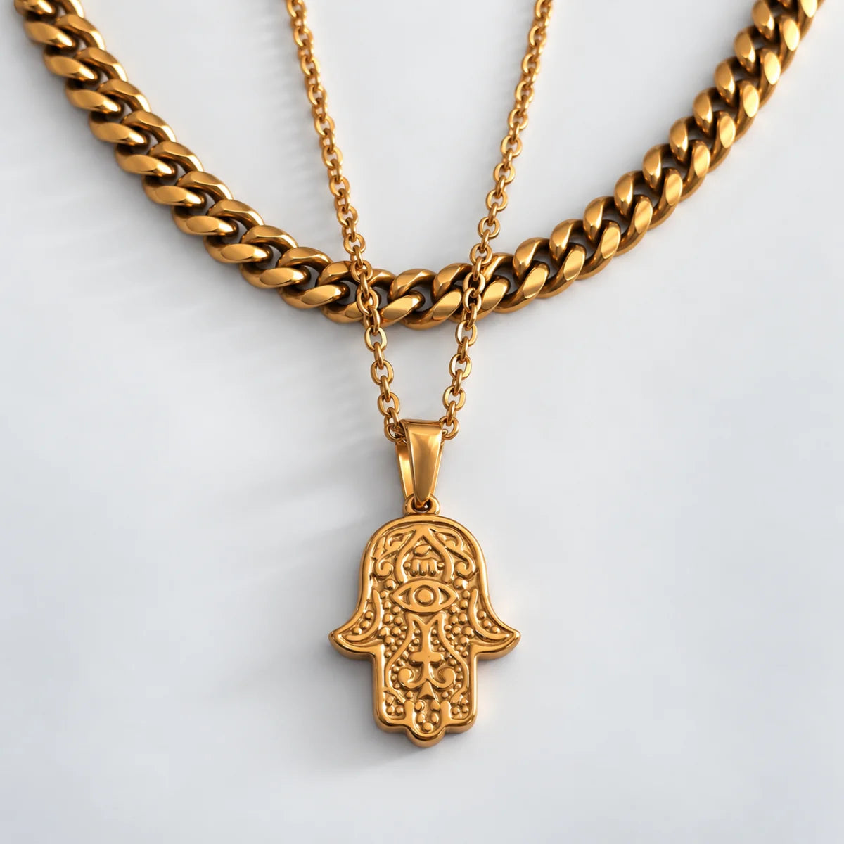 hamsa pendant necklace gold layered set white background