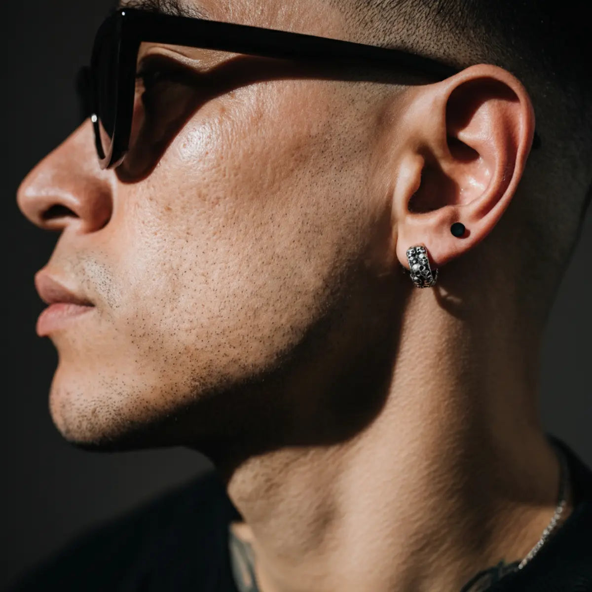 6mm Silver Skull Cluster Huggie Hoop Earrings Worn by Male Model Side