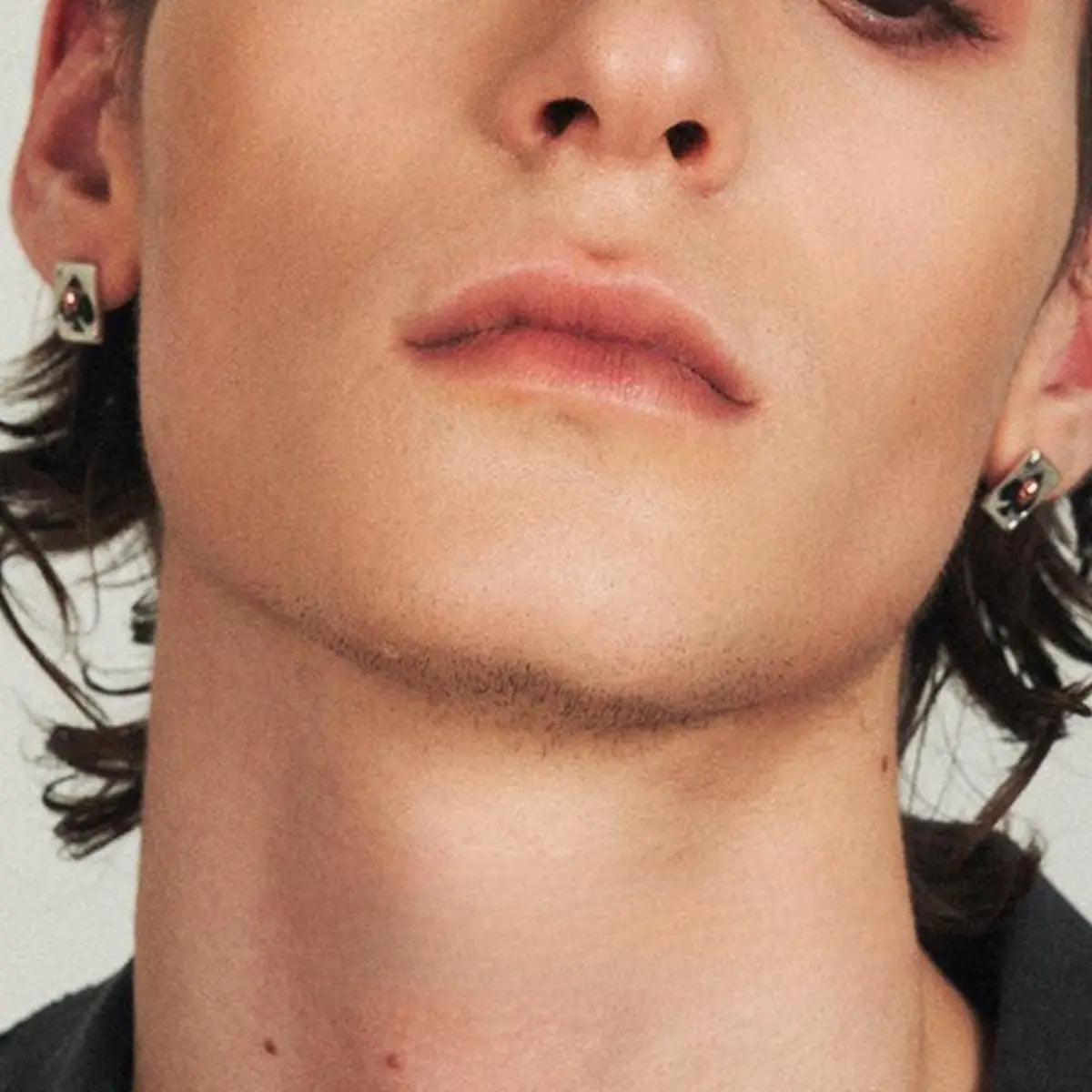 Ace of Spades Skull Earrings Worn by Male Model Front View