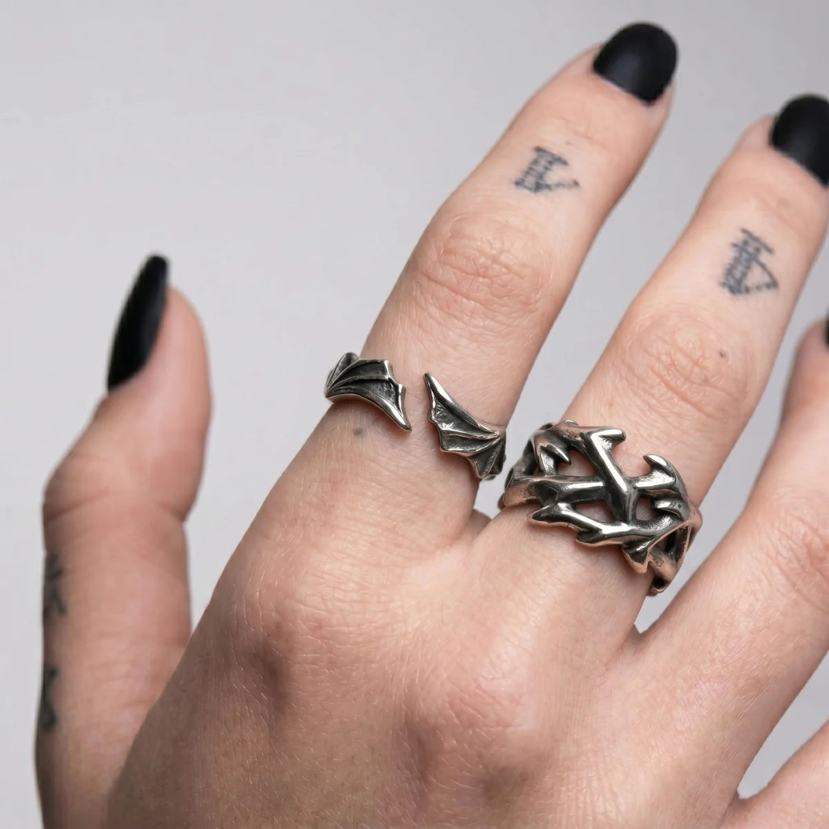Bat Wing Ring and Vintage Crown of Thorns Ring Worn by Female Model