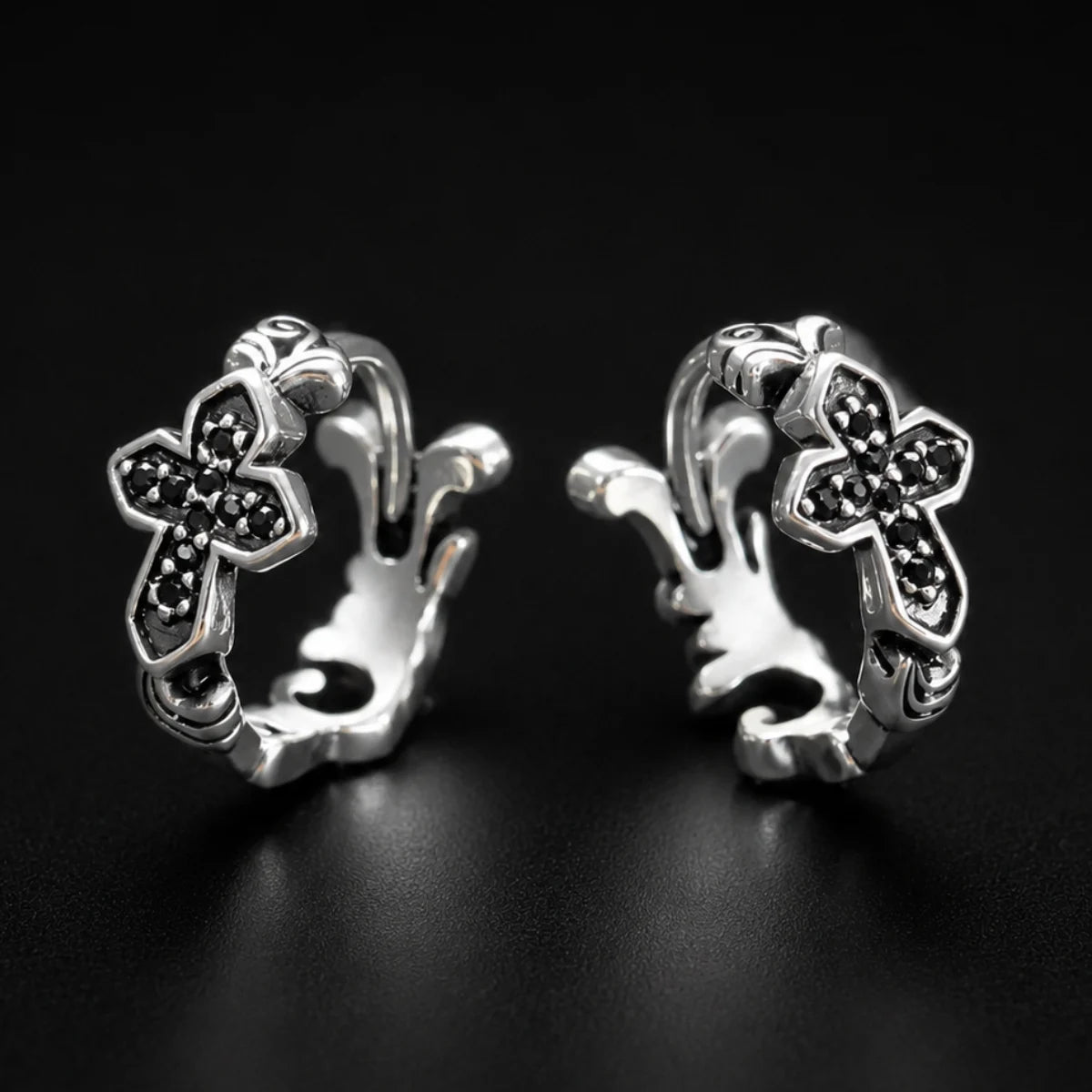 Black CZ Cross Huggie Hoop Earrings Silver Pair Close Up Black Background