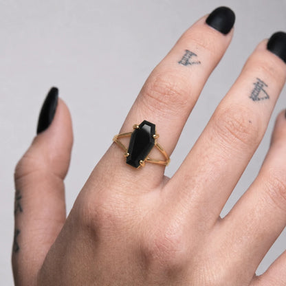 Black Coffin Ring Gold Worn on Hand Close Up