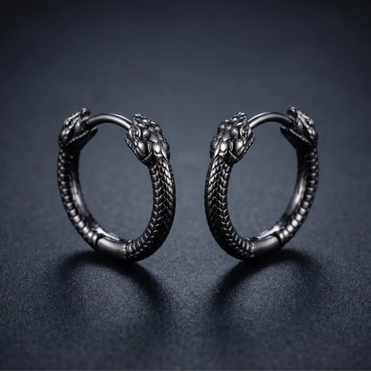 Black Double Snake Head Hoop Earrings Close Up Black Background