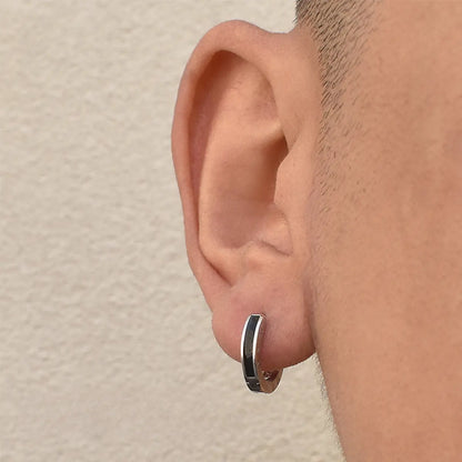 Black Roman Numeral Stud Earrings Worn by Male Model Front View