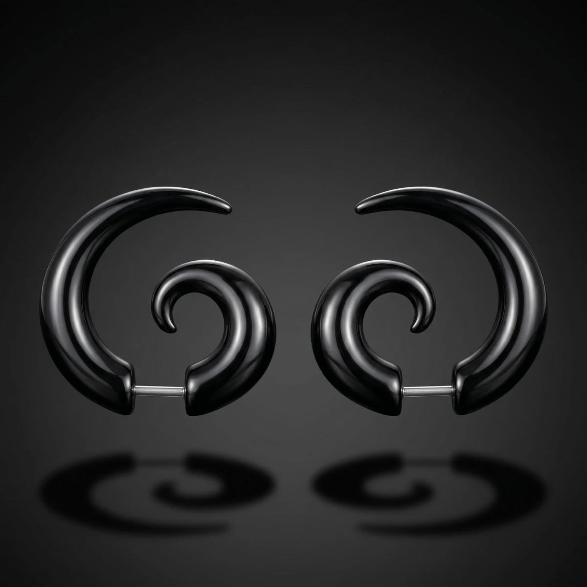 Black Spiral Horn Earrings Pair Close Up Black Background with Reflection