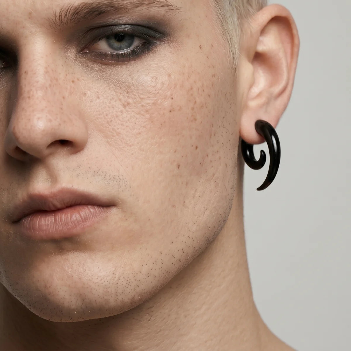 Black Spiral Horn Earrings Worn by Male Model Front Side View