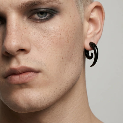 Black Spiral Horn Earrings Worn by Male Model Front Side View