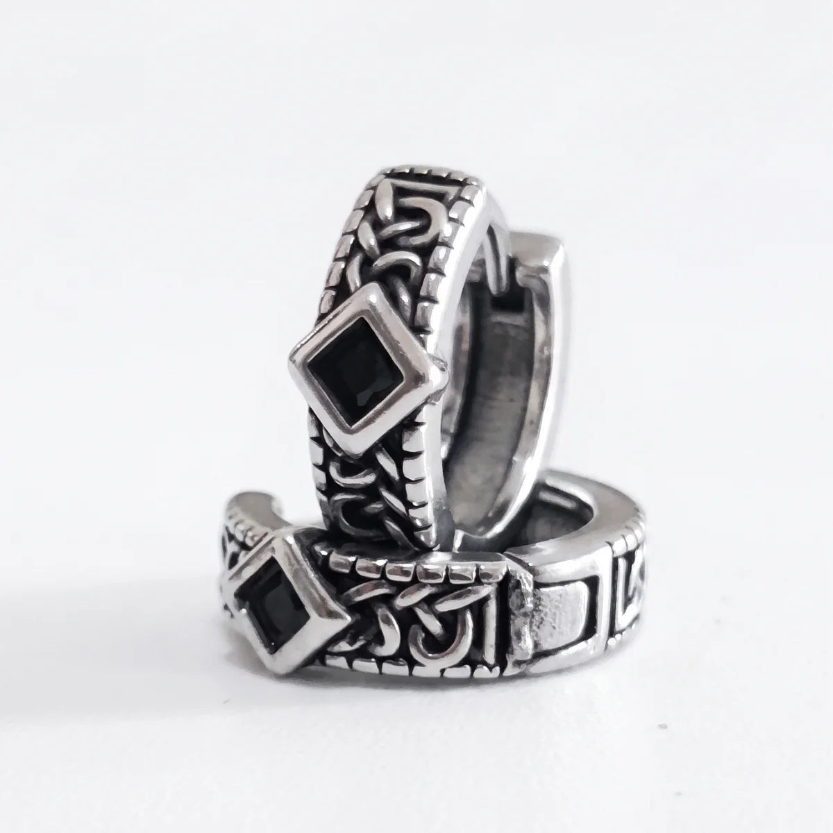 Black Stone Celtic Hoop Earrings Silver Pair Stacked Front View White Background