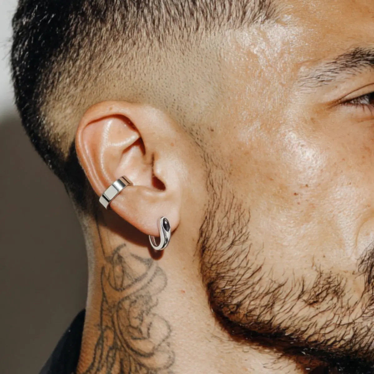 Black Teardrop Stud Earrings Worn by Male Model