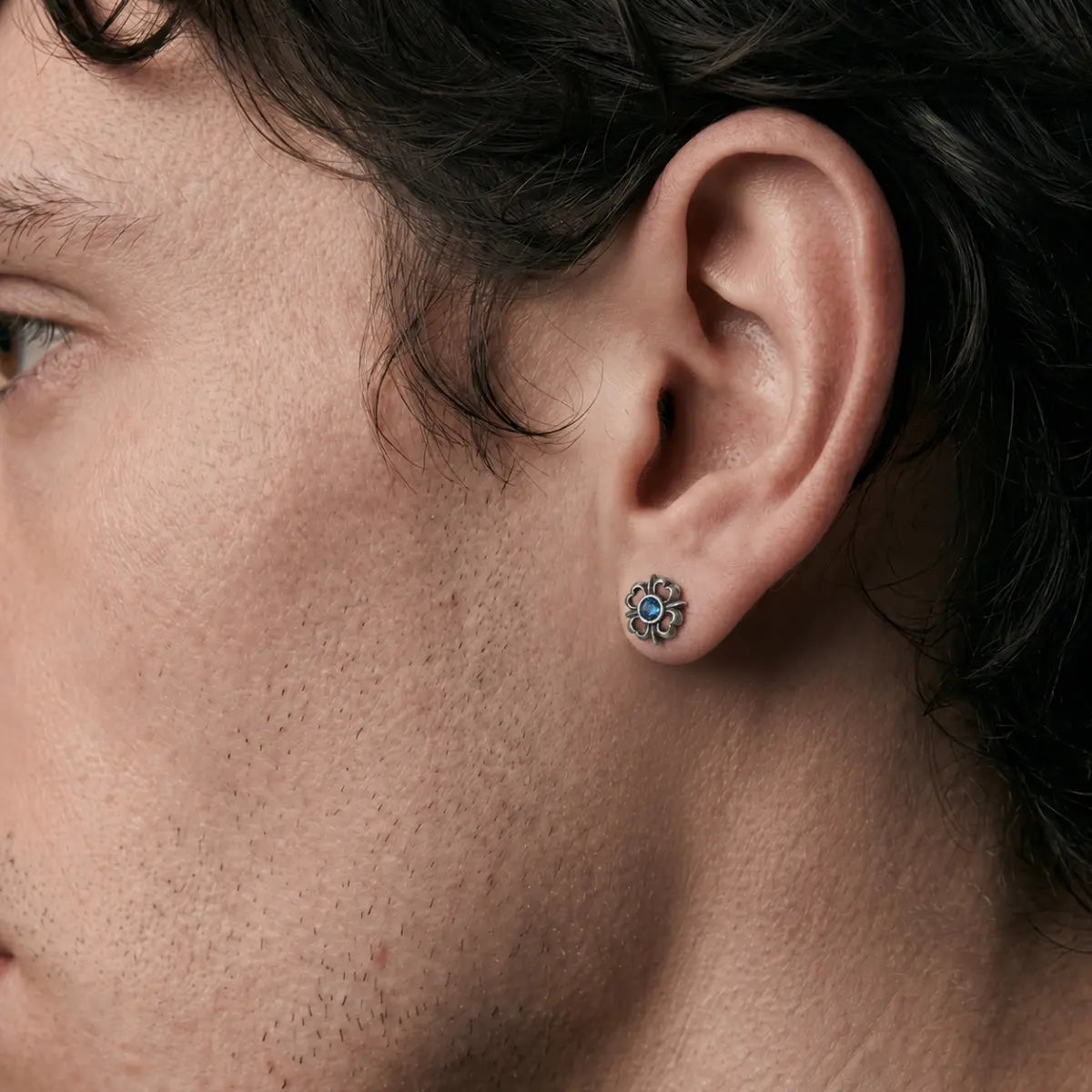Blue Gem Gothic Stud Earrings 925 Silver Worn by Male Model Close Up