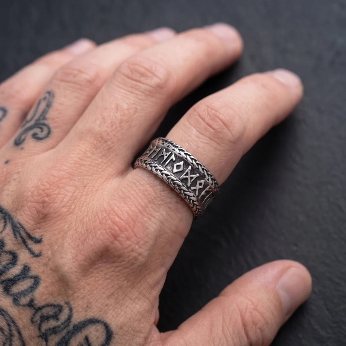 Braided Edge Rune Ring Silver Worn on Hand Close Up
