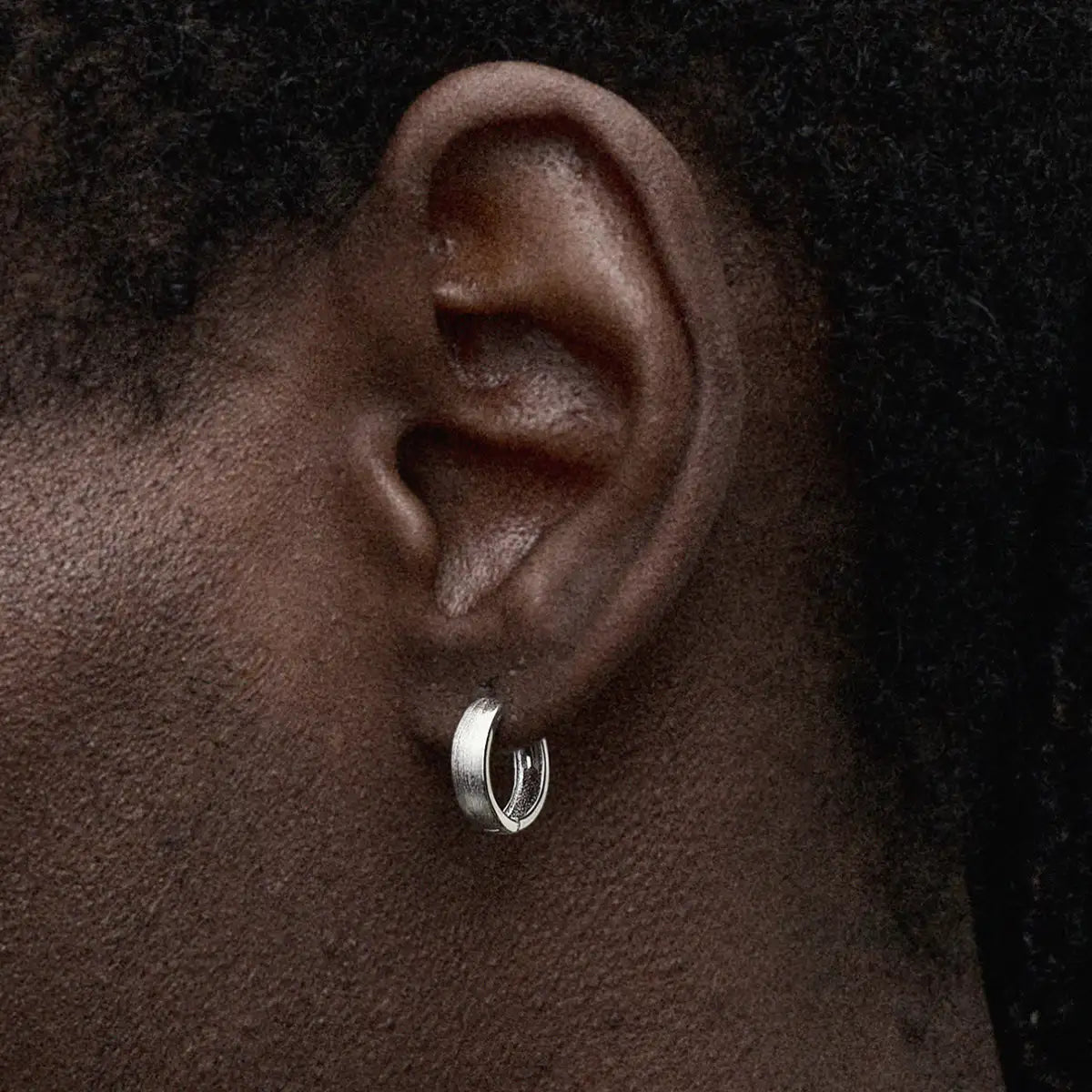 Brushed Silver Hoop Earrings Worn by Male Model