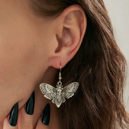 Butterfly Skull Dangle Earrings Silver Worn by Female Model