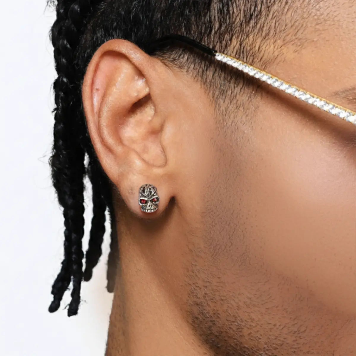 Carved Red Eye Skull Stud Earrings Worn by Male Model