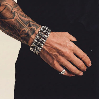 Chunky Multi Row Roller Skull Bracelet Worn by Male Model