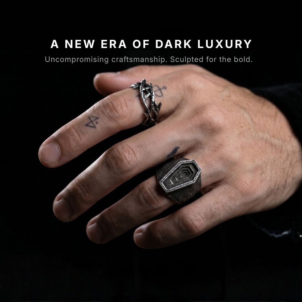 Close-up of Men's Stackable Coffin and Thorns Rings on Dark Slate | Alternative Gothic Accessories