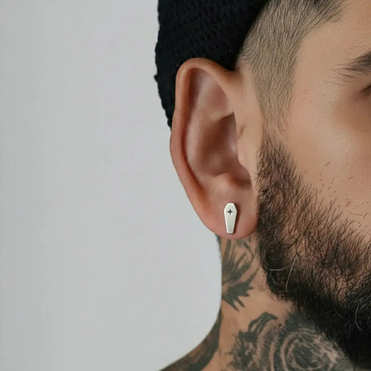 Coffin Cross Stud Earrings Worn by Male Model