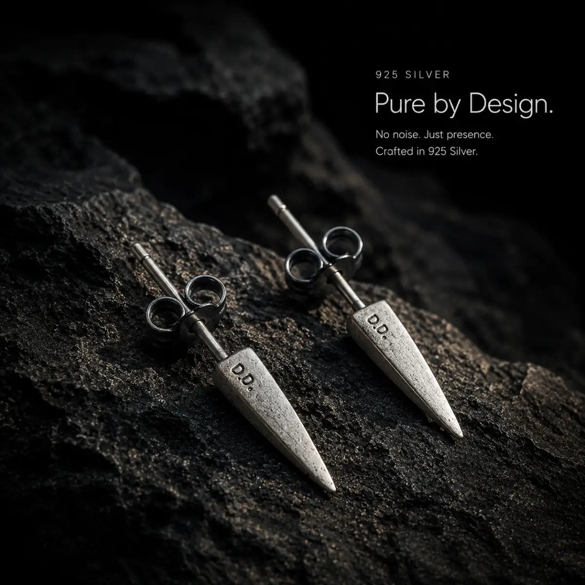 Cone Stud Earrings 925 Silver Pair Displayed on Stone Surface