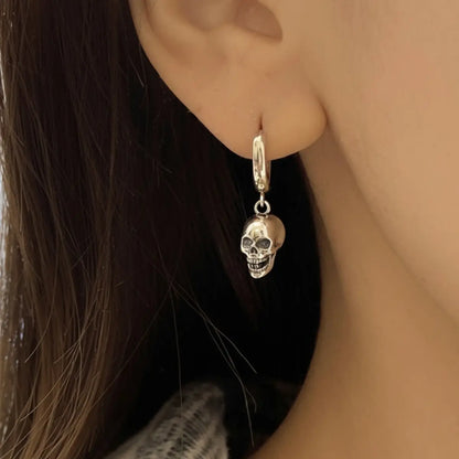 Copper Skull Head Hoop Earrings Worn by Female Model
