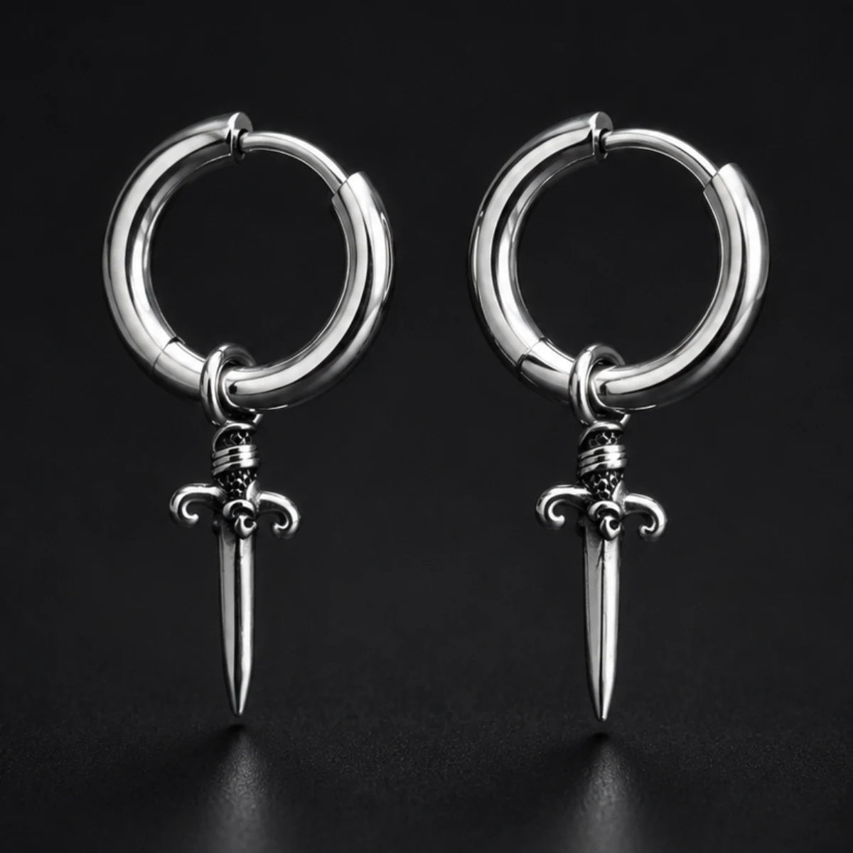 Dagger Drop Hoop Earrings Silver Pair Close Up Black Background