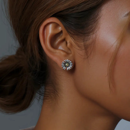 Daisy stud earrings sterling silver gold worn by female model