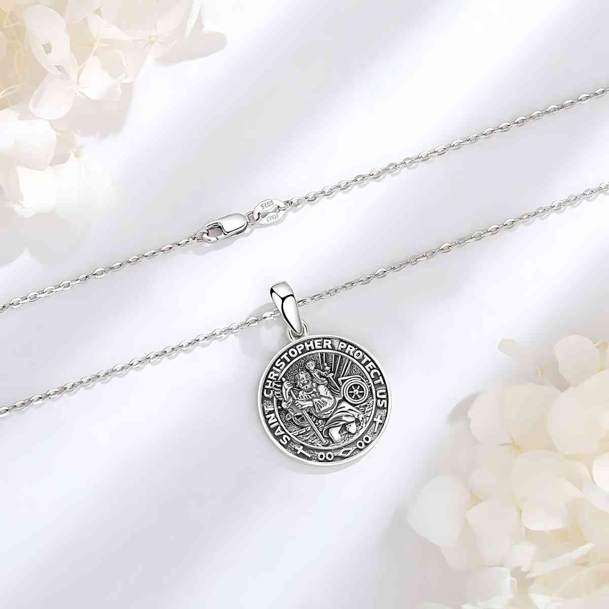 Detailed St Christopher Medal Necklace Displayed on White Surface Xenos Jewelry