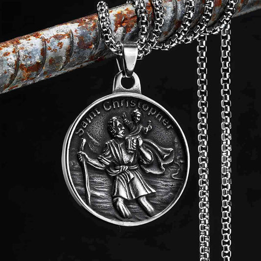 Detailed Vintage St Christopher Medallion Necklace Displayed on Rusty Pipe Xenos Jewelry