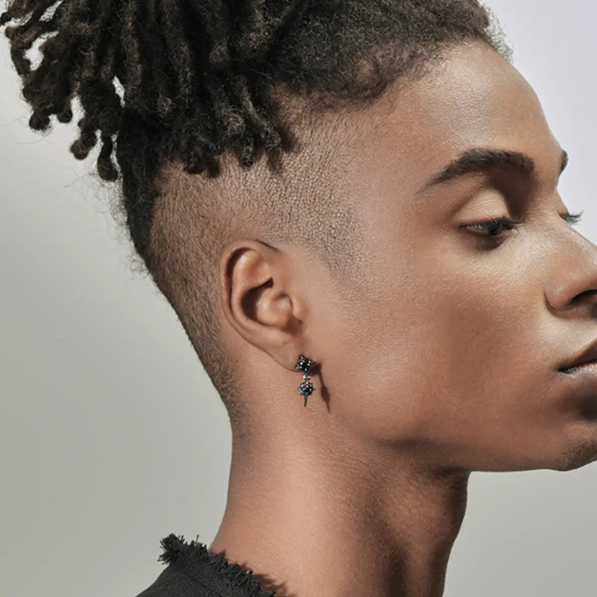 Double North Star Diamond Drop Stud Earrings Worn by Male Model Front