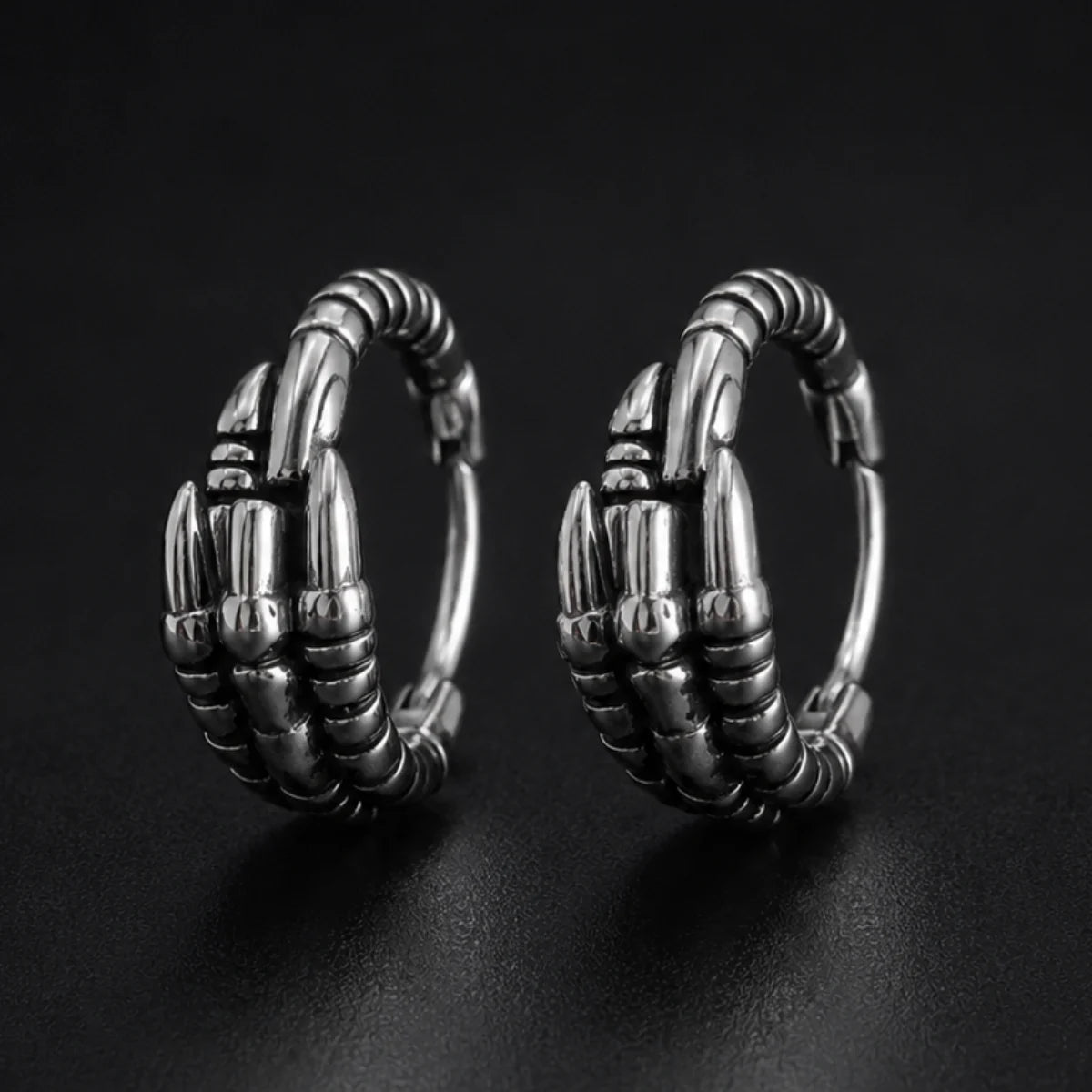 Dragon Claw Hoop Earrings Silver Pair Close Up Black Background