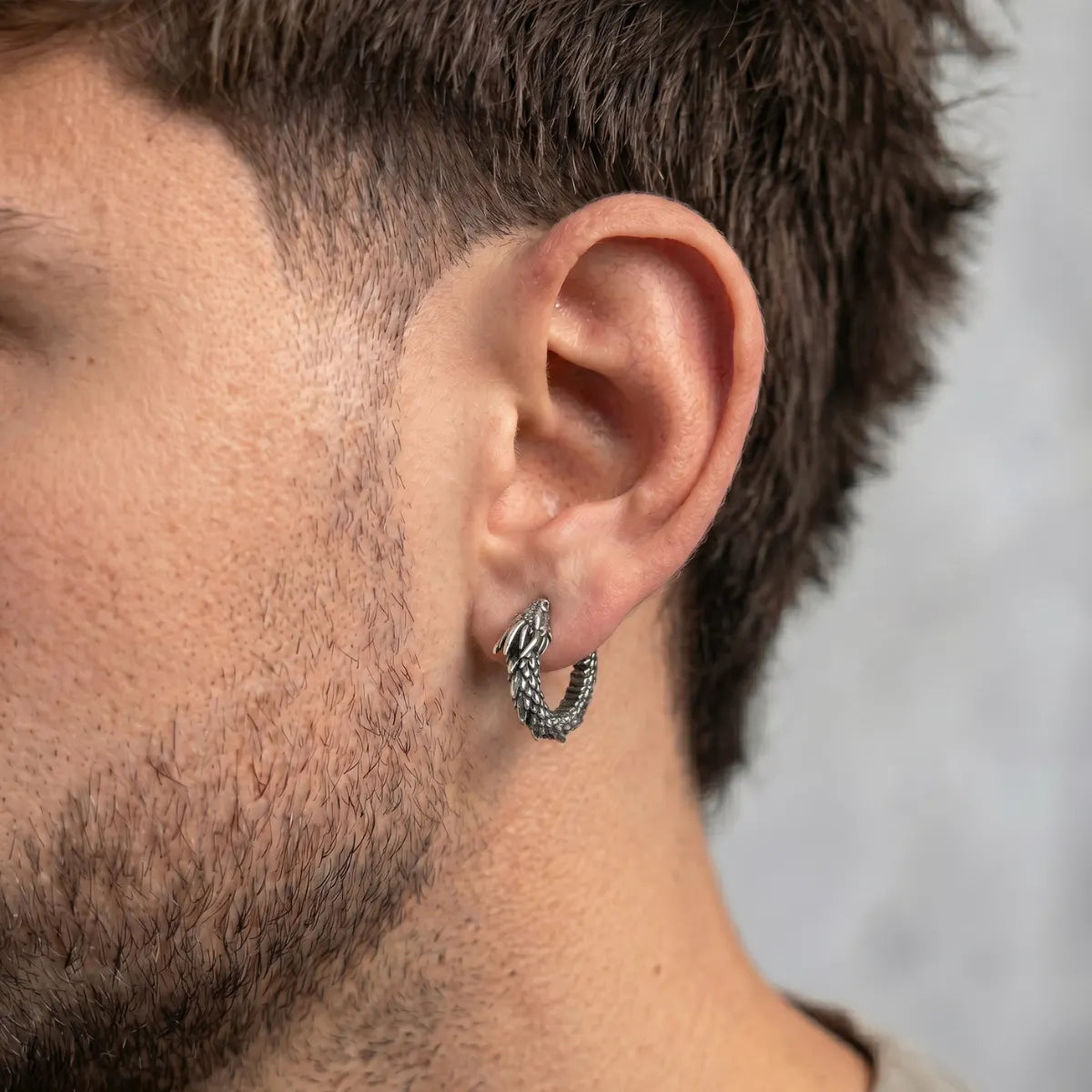 Dragon Huggie Earrings Silver Worn by Male Model