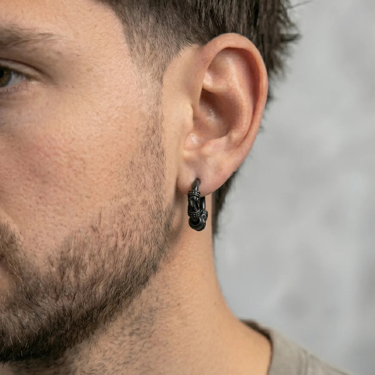 Dragon Scale Earrings Black Worn by Male Model