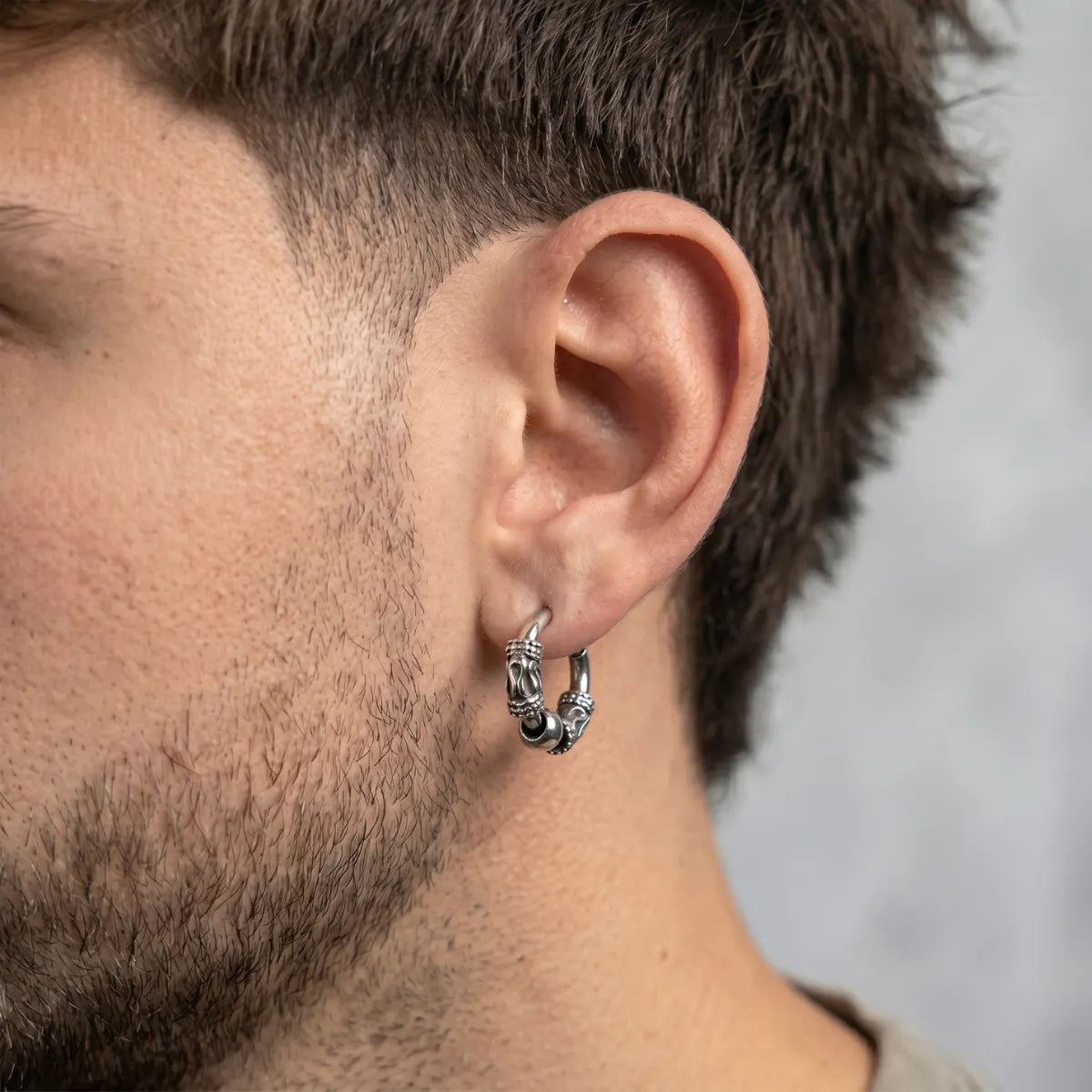 Dragon Scale Earrings Silver Worn by Male Model