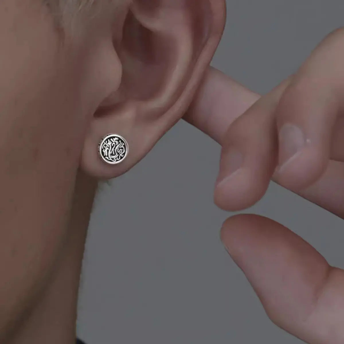 Dragon Stud Earrings Sterling Silver Worn by Male Model Close Up