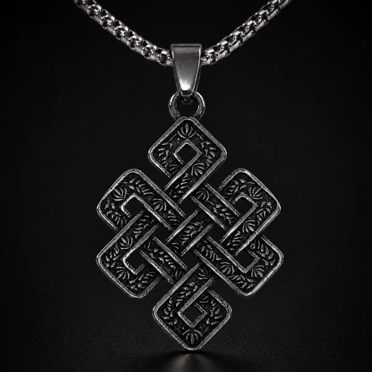 Endless Knot Necklace Silver Close Up Black Background