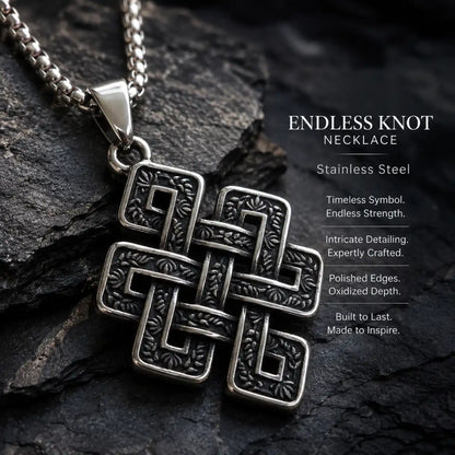 Endless Knot Necklace Silver Displayed on Stone Surface