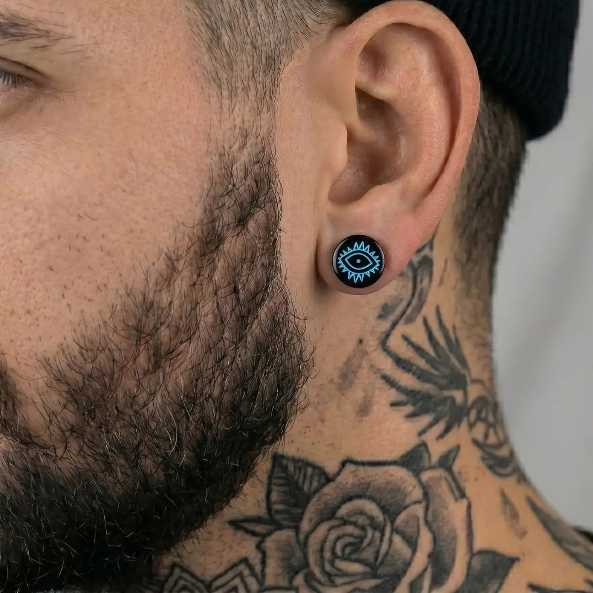 Evil Eye Barbell Stud Earrings Black Worn by Male Model