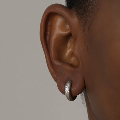 Eye of Horus Huggie Hoop Earrings White Gold 4mm Worn by Male Model Close Up