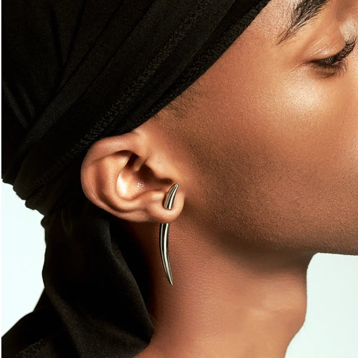 Fang Spike Stud Earrings Worn by Male Model Front View