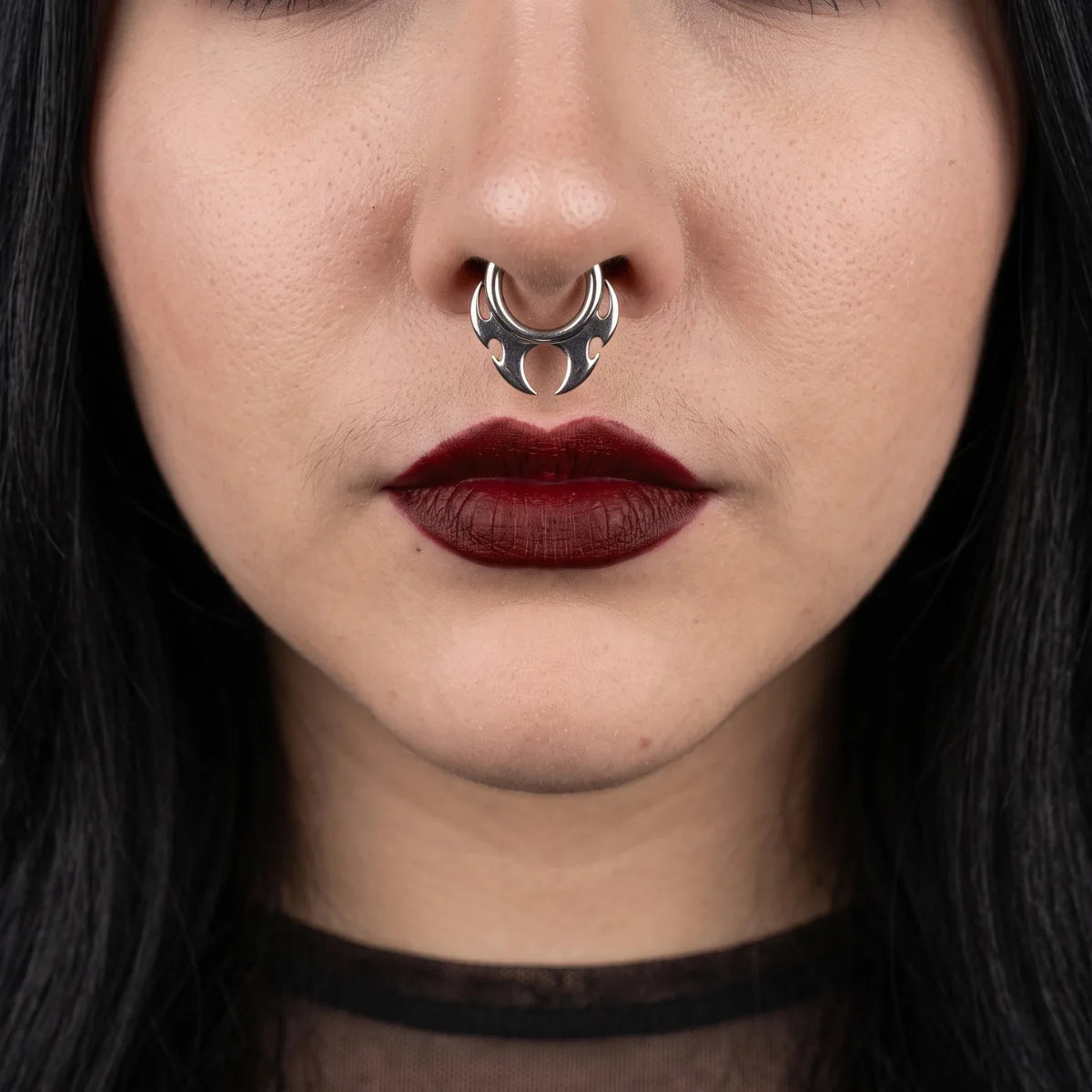 Flame Blade Earrings Silver Worn as Septum Ring by Female Model