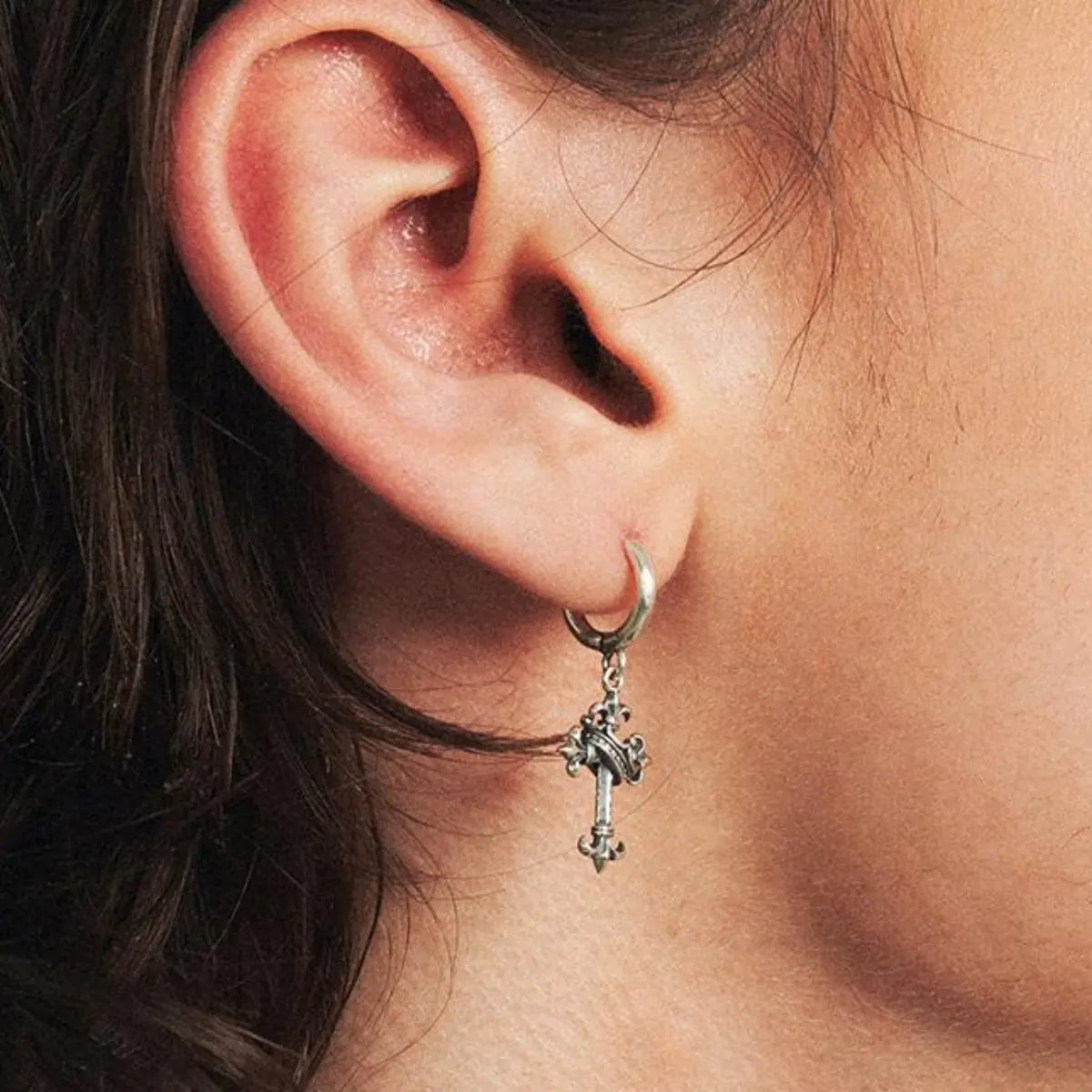 Fleur de Lis Cross Earrings Worn by Male Model Close Up