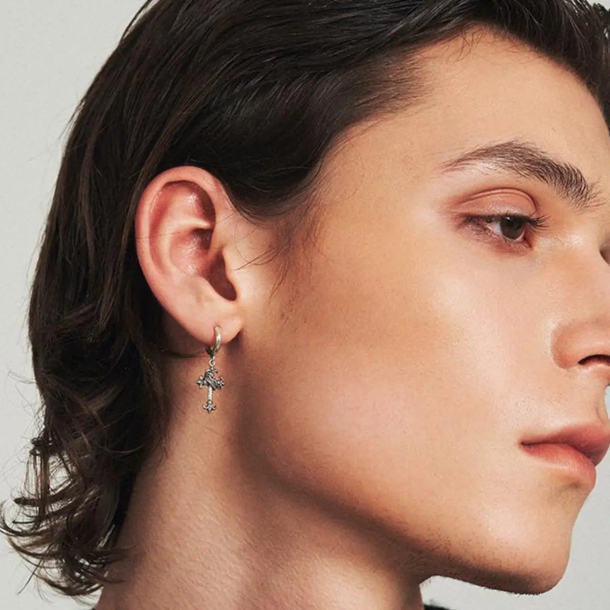 Fleur de Lis Cross Earrings Worn by Male Model