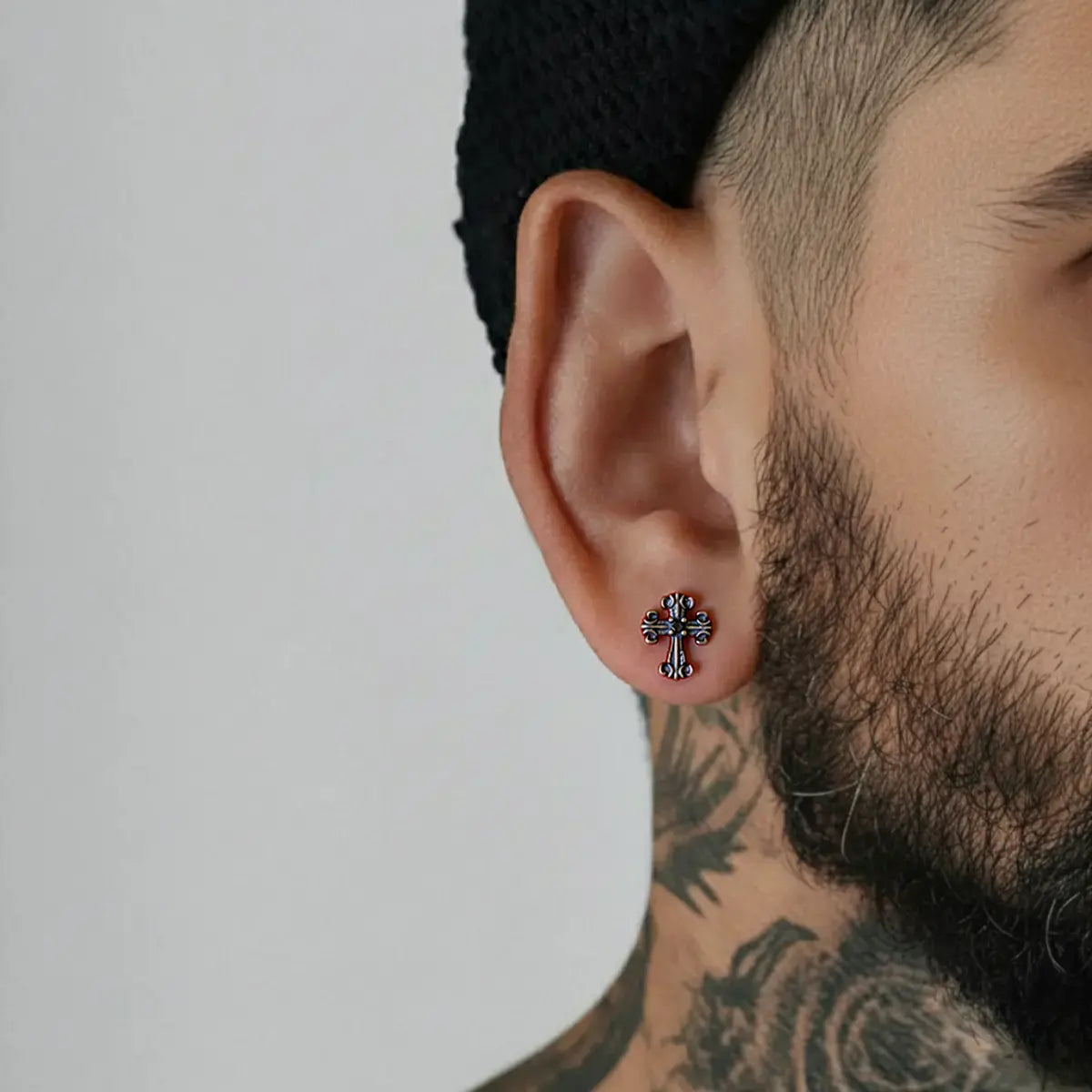 Fleur de Lis Cross Stud Earrings Worn by Male Model