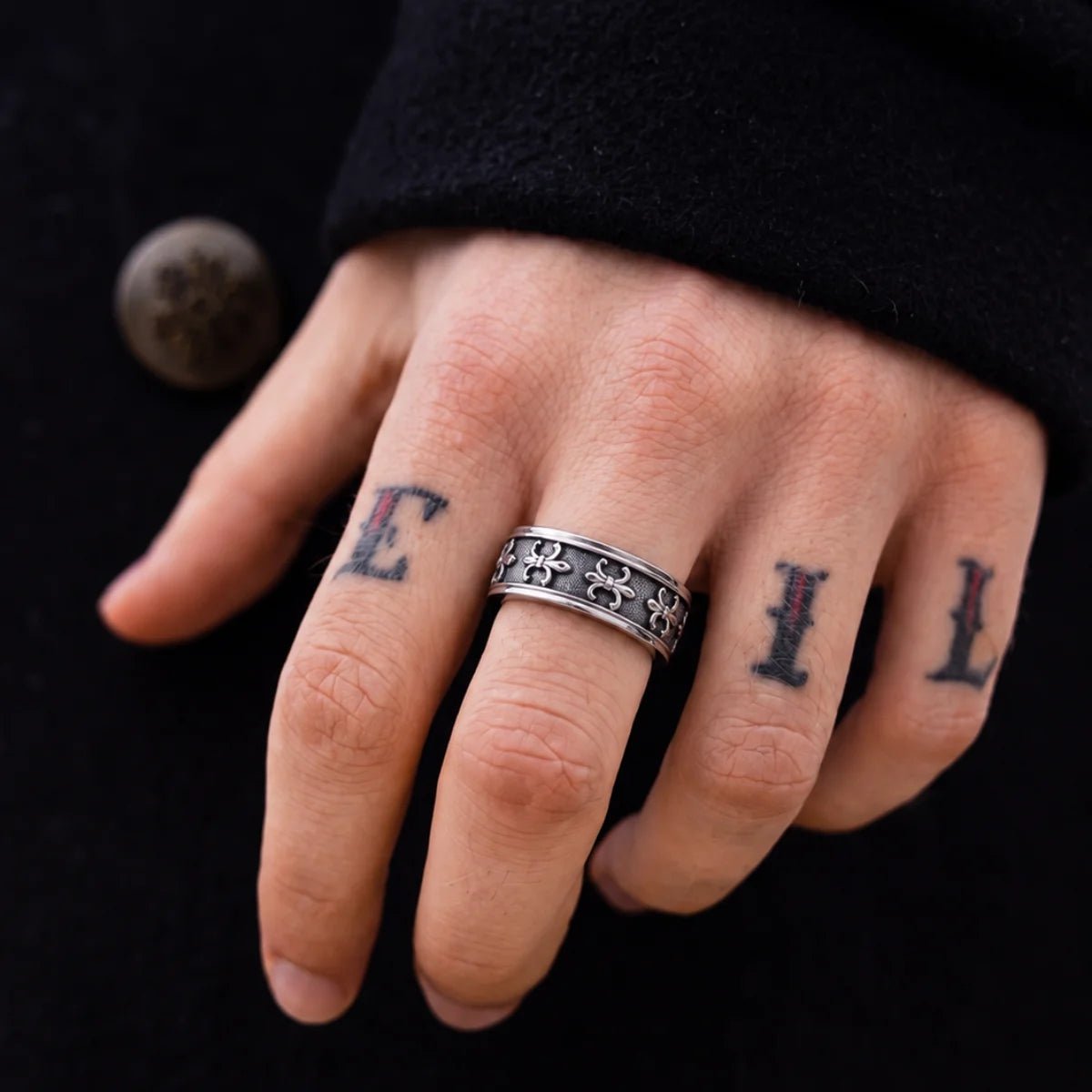 Fleur de Lis Spinner Ring Silver Worn on Hand Close Up