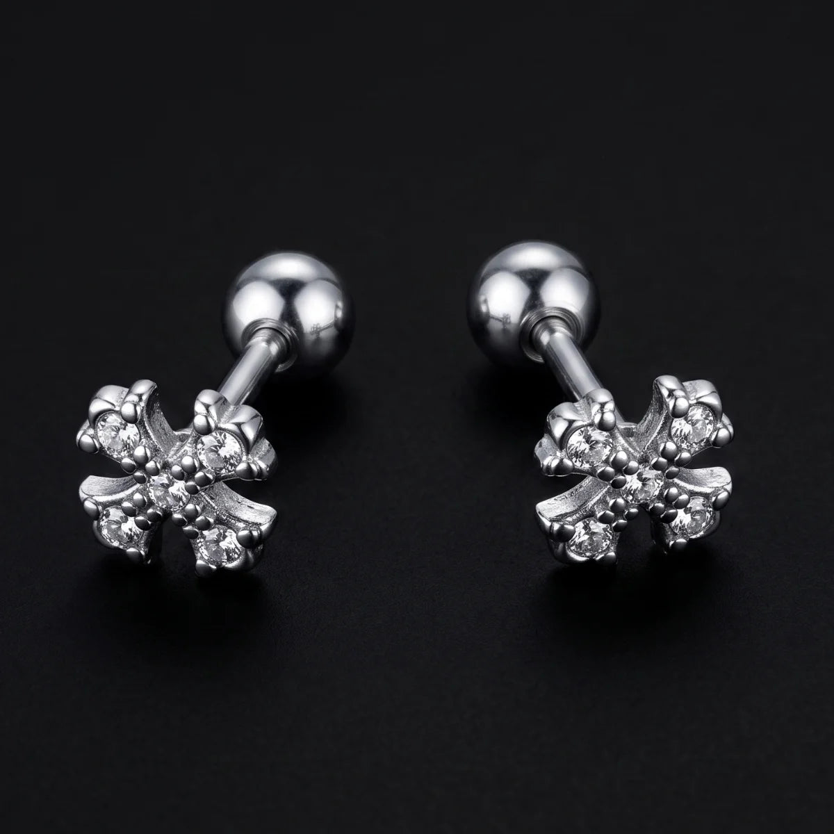 Floral Cross Cartilage Stud Earrings Premium Stainless Steel Close Up Black Background