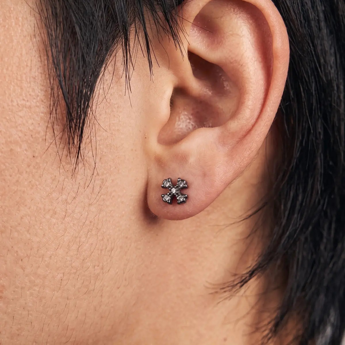 Floral Cross Cartilage Stud Earrings Premium Stainless Steel Worn by Male Model