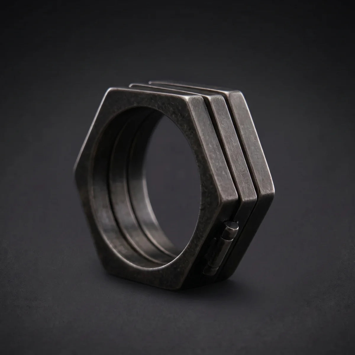 Folding Hex Ring Stacked Close Up Black Background