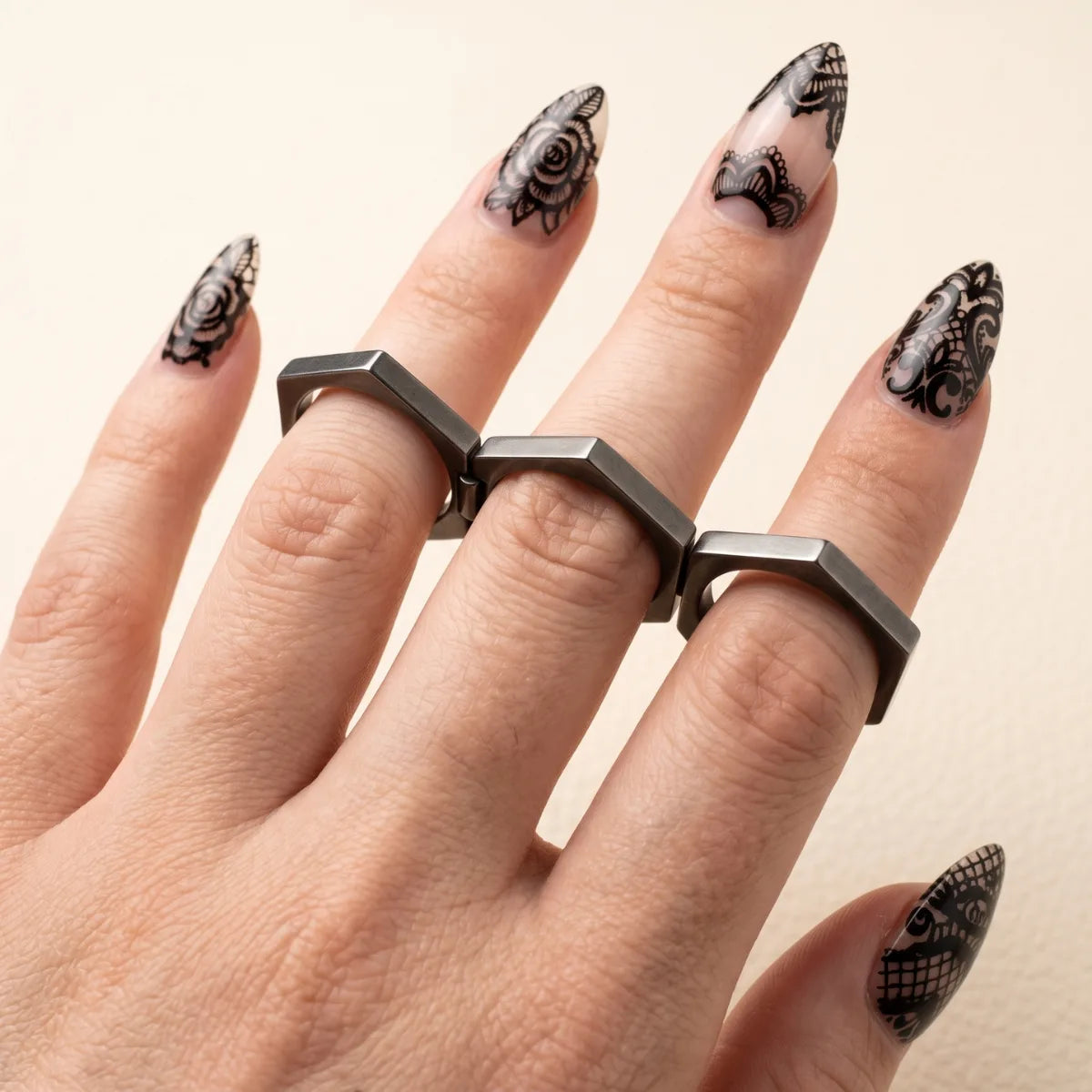 Folding Hex Ring Unfolded Worn across Three Fingers on Female Hand