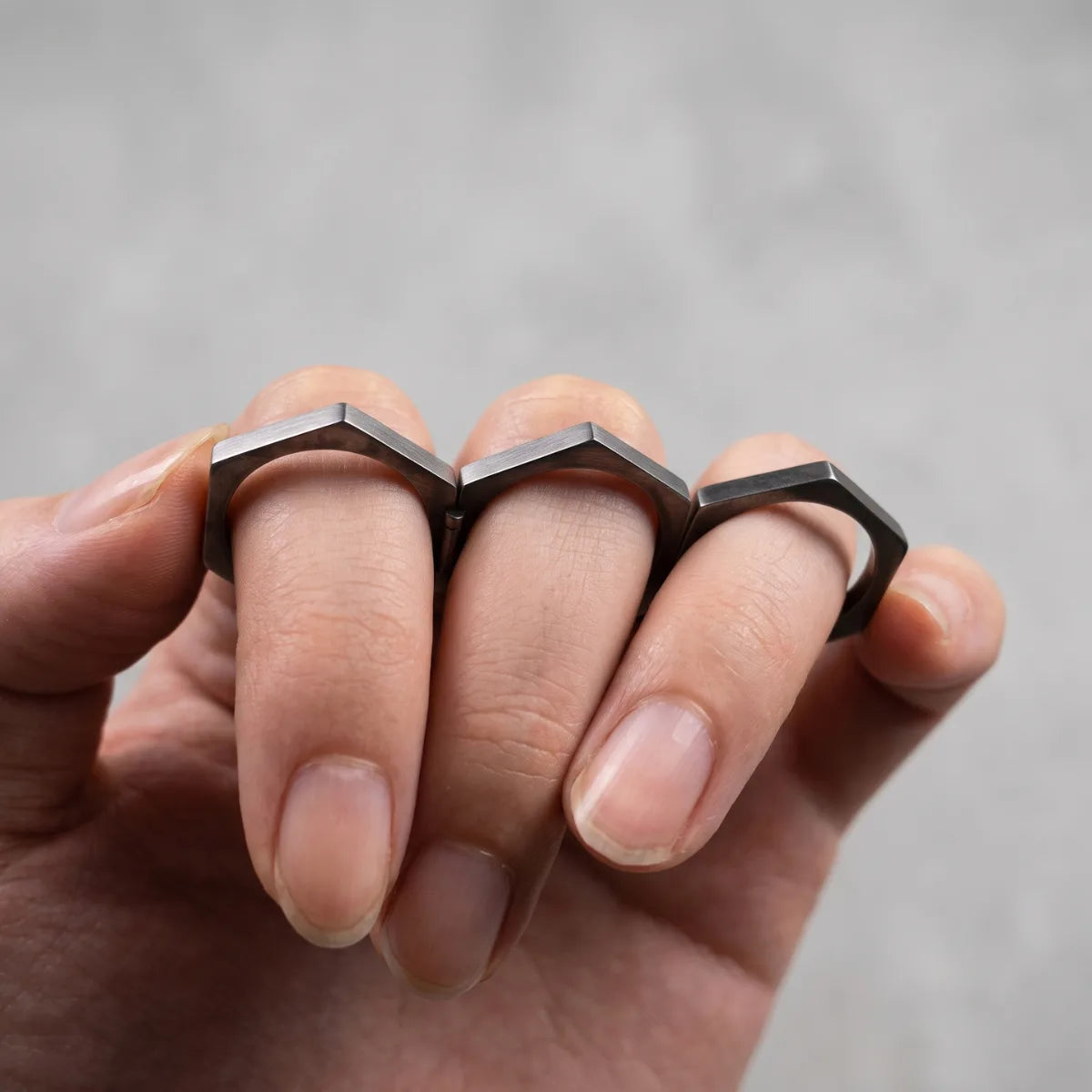 Folding Hex Ring Unfolded Worn by Model Close Up