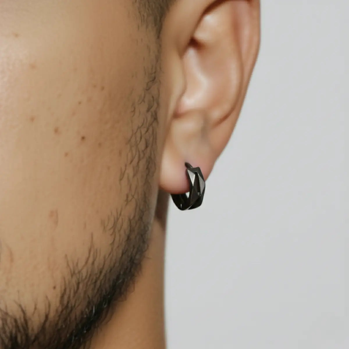 Geometric Hoop Earrings Black Worn by Male Model Close Up